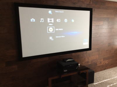 Home Theater System with elegant wood wall.